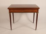 a small table with a drawer on the top of it