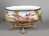 a large bowl with a painting on it on a stand
