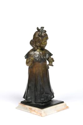 bronze statue of a girl holding a bird on a marble base