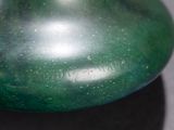 a close up of a green object on a table