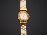 a close up of a gold watch on a black background