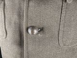a close up of a jacket with buttons on it