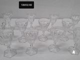 a lot of glasses that are sitting on a table