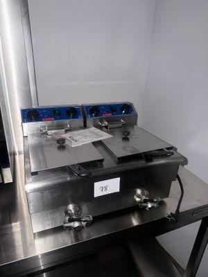 a metal table with a bunch of items on top of it