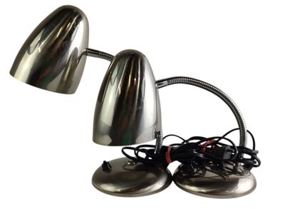 two chrome desk lamps on a white background with wires