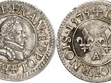 a silver coin with an image of a man on it