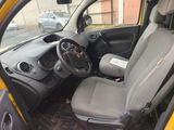 a small yellow car with a steering wheel and a dashboard