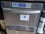 a silver dishwasher with a number 6 on it