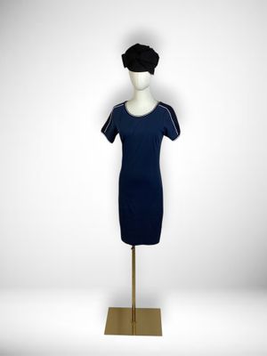 a mannequin with a black hat and a blue dress