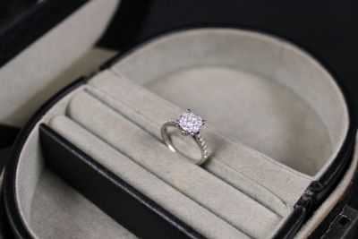 a diamond ring in a ring case on a table