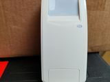 a small white device sitting on top of a black box