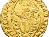 a gold coin with an image of a man holding a shield