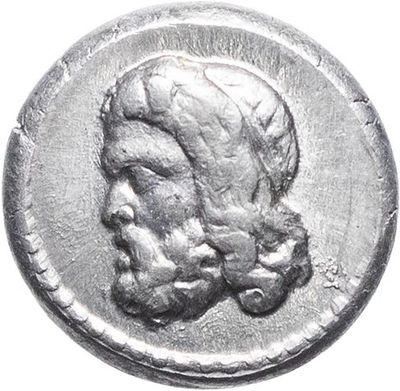 a silver coin with an image of a man ' s head on it