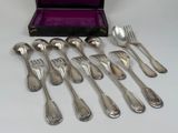 a lot of silver spoons and forks in a purple case