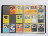 a lot of different pokemon cards on the table