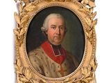 portrait of a man in a gold frame with a cross on it