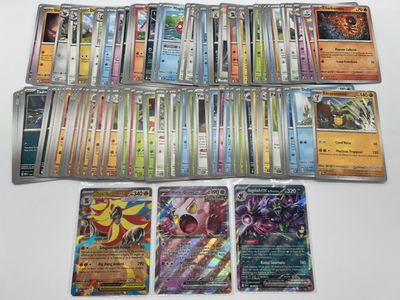 a lot of different pokemon cards on the table