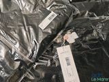 a pile of clothing that has been wrapped in plastic