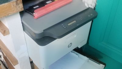 a printer that is sitting on top of a drawer