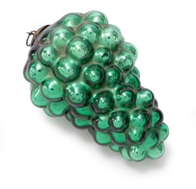 green glass grapes ornament on a white background
