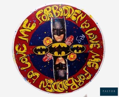 une photo d'un gâteau sur lequel figurent Batman et Batmangirl