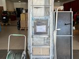 a picture of a cart with a ladder and a cart with a hose on it