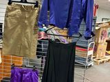 a display of clothing on a metal rack in a store