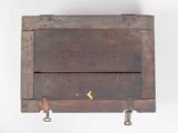 a wooden box that has a yellow bird on it
