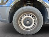 a close up of a tire on a blue truck