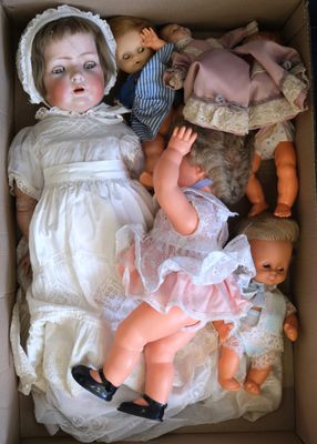 a box with a doll in it and a doll in it
