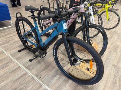 many bikes that are lined up on the floor