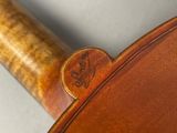 a close up of a wooden handle on a guitar