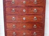 an antique chest of drawers with a marble top and brass pulls