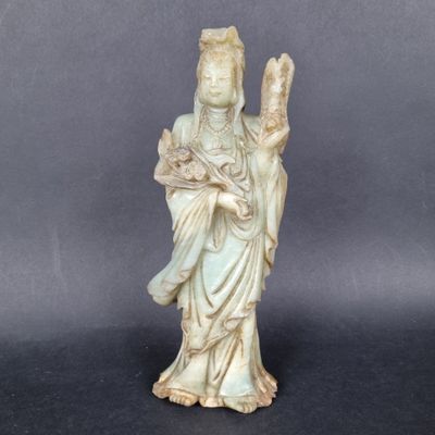 an image of a statue of a woman holding a bird