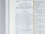 an open book with a page in it on a table