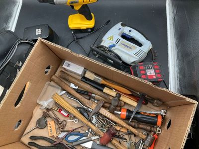 a box full of tools sitting on a table
