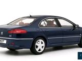 the blue car is parked on a white surface with a white background