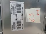a sticker on the side of a refrigerator that has a price tag attached to it