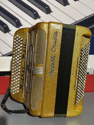 Accordéon d'occasion MICHEL MELLI FRATELLI CROSI0 or 120. - Photo 1