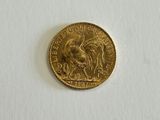 an image of a gold coin on a white surface