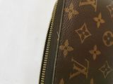 a close up of a brown louis vuitton bag