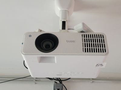 a projector that is attached to the ceiling