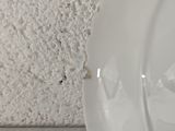 a close up of a white plate on a table