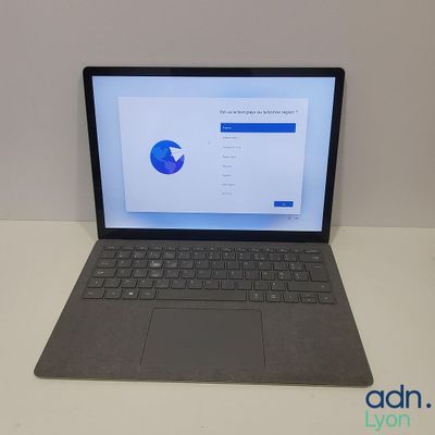 the laptop is sitting on the table with the screen open