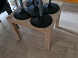 a table with four speakers on it in a room