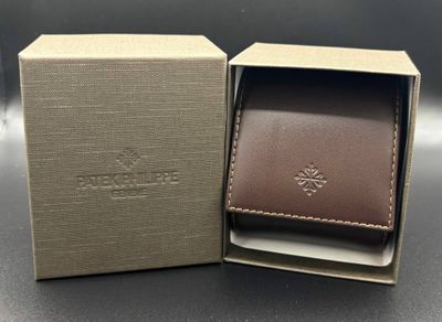 a close up of a box with a wallet inside of it