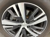 a close up view of a tire on a car
