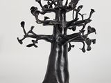 sculpture of a tree with birds perched on it on a white background