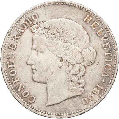 a close up of a coin with a woman ' s head on it
