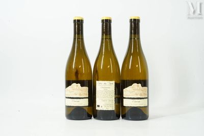 three bottles of wine sitting next to each other on a table